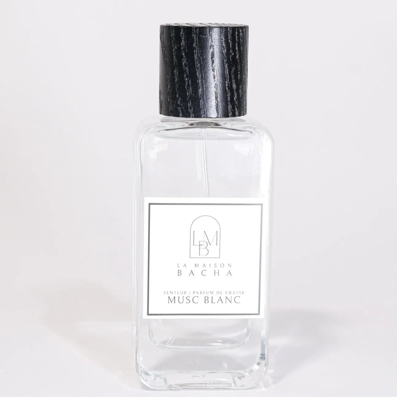 Flacon en verre de parfum d'intérieur Musc Blanc, élégant avec bouchon en bois naturel.